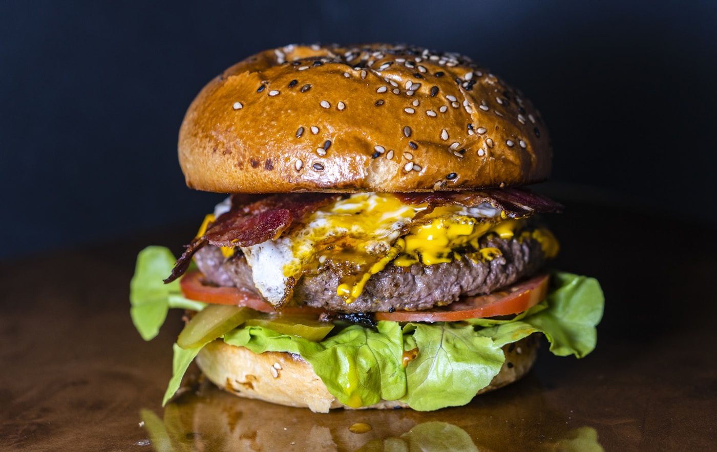 Fresh smash burger patties on a hot grill