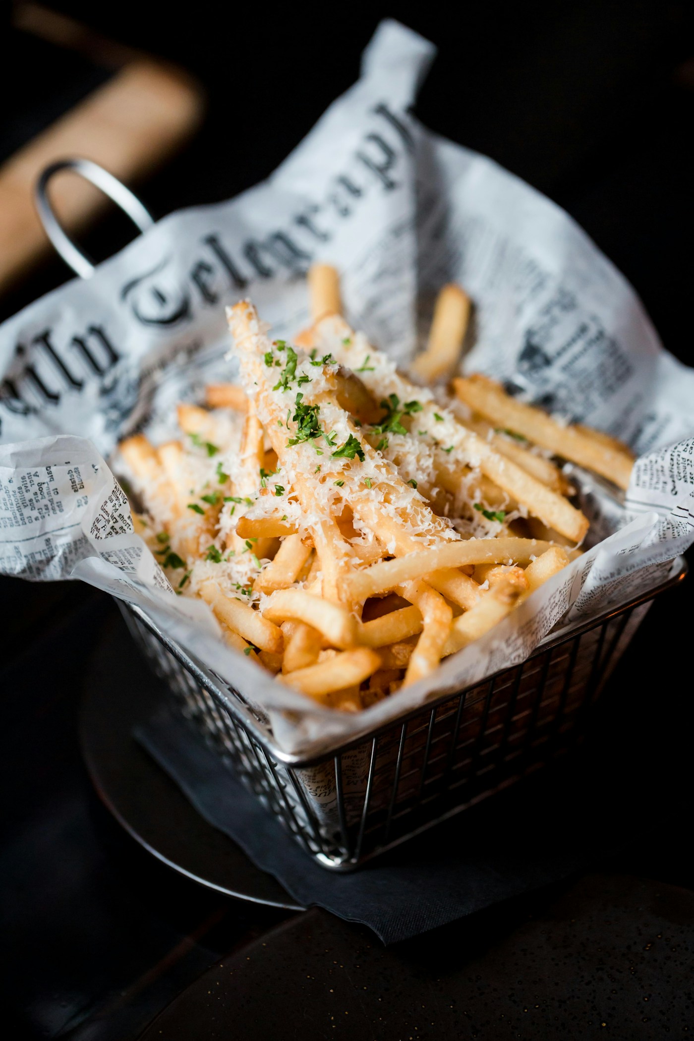 Crispy fries in a basket with dipping sauce