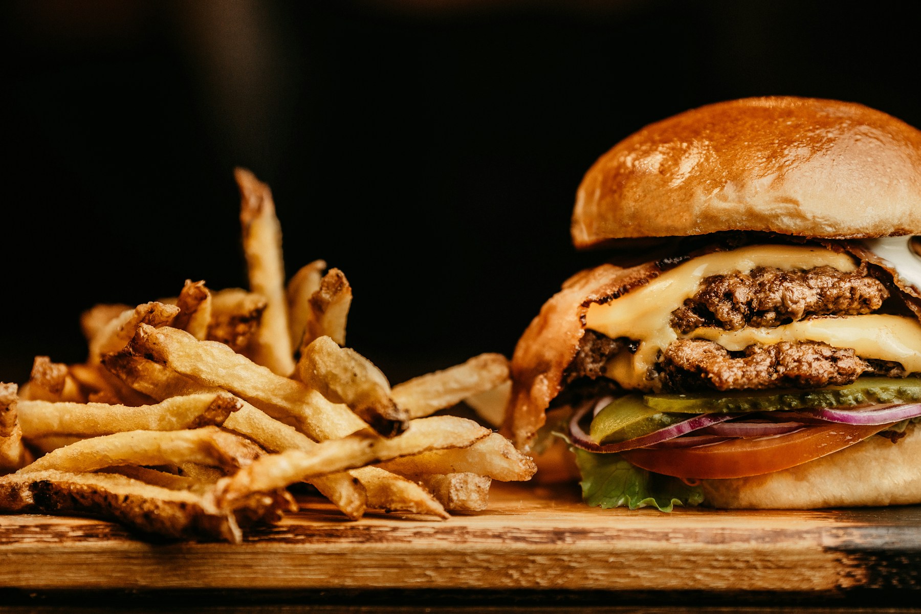 Toasted burger bun with beef patty and toppings