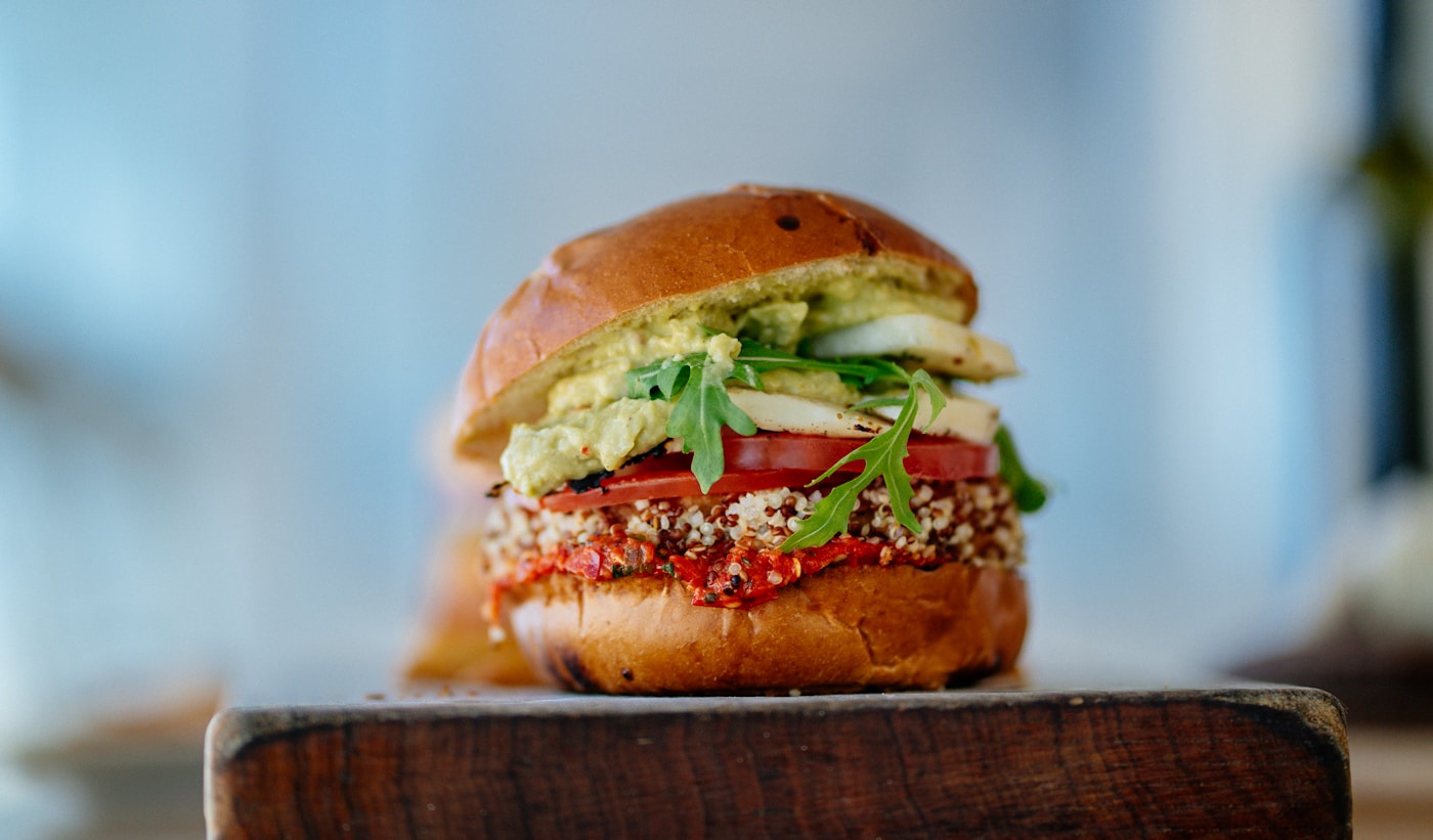 Vegetable burger with bun, greens, and toppings